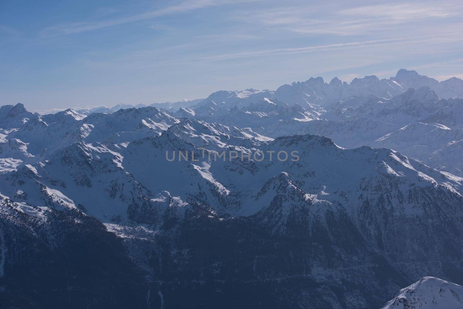 mountain landscape at winter with fresh snow on beautiful sunny day at french alps