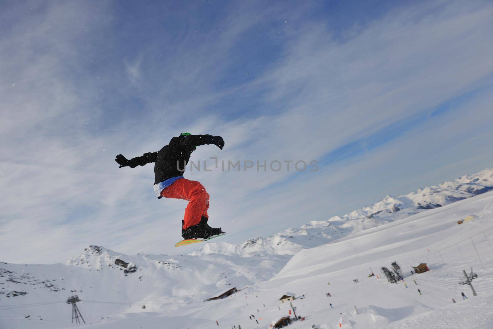 happy young man have fun at winter on mountain peak by dotshock