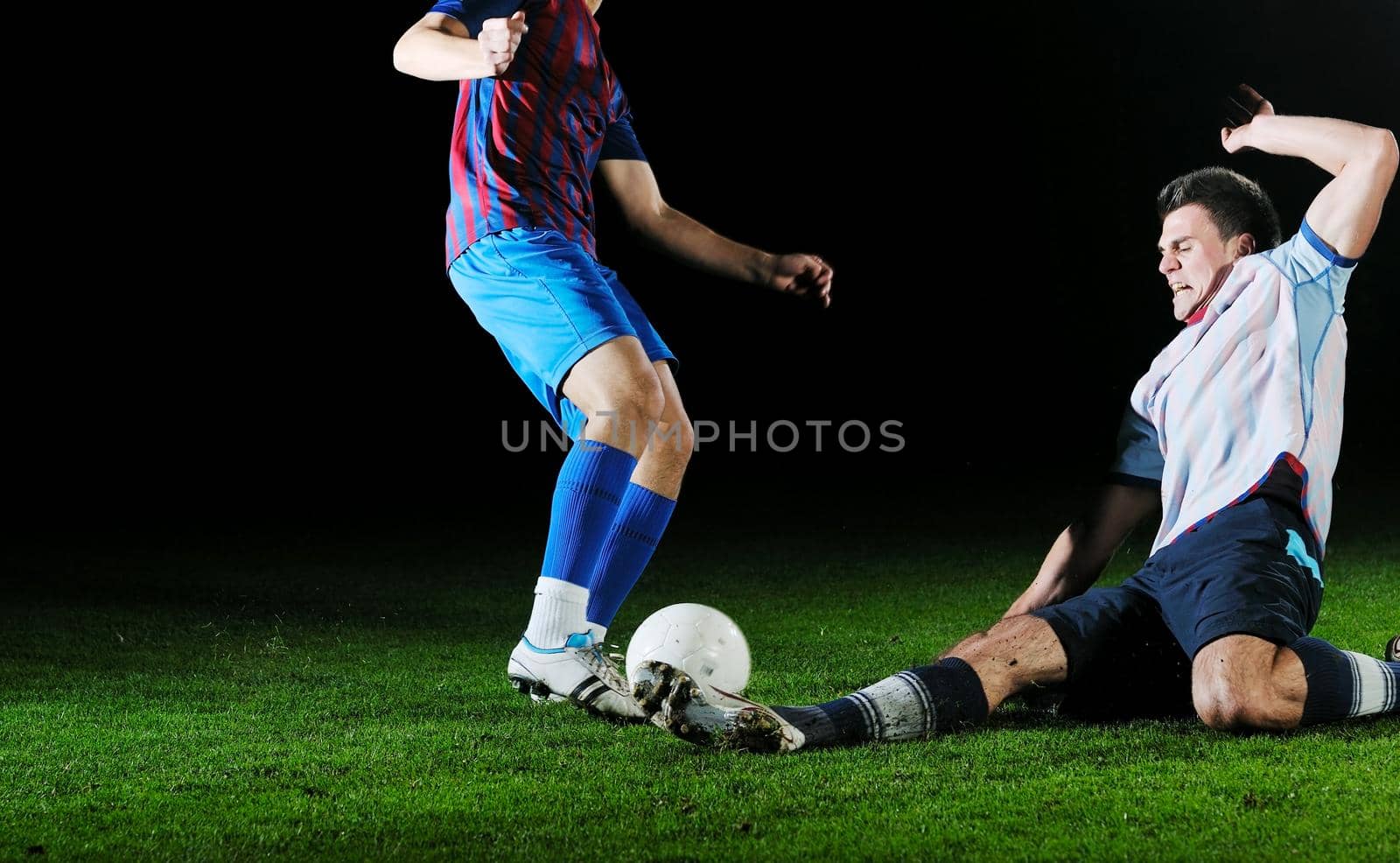 football players in competition for the ball by dotshock