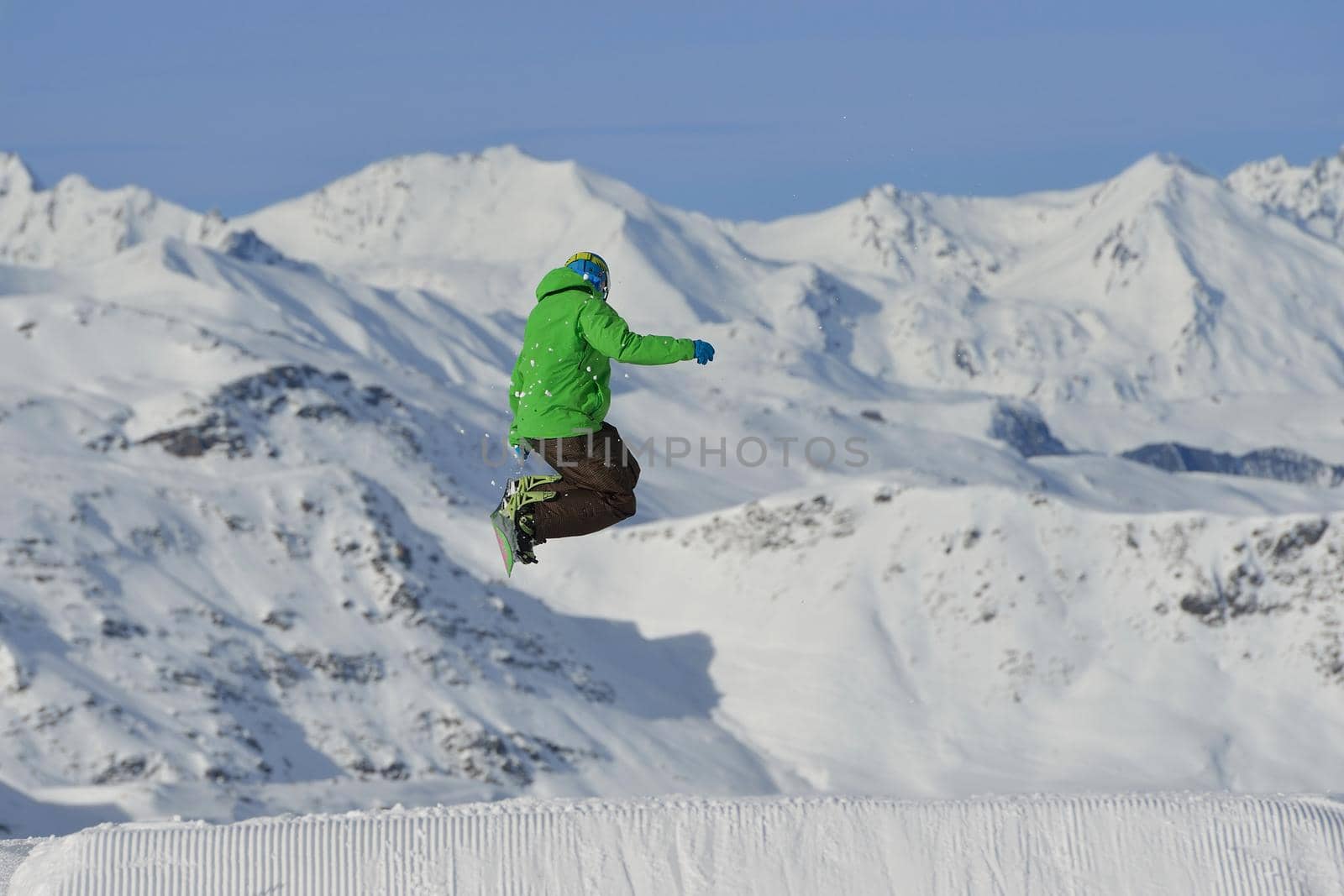 jumping skier at mountain winter snow fresh suny day