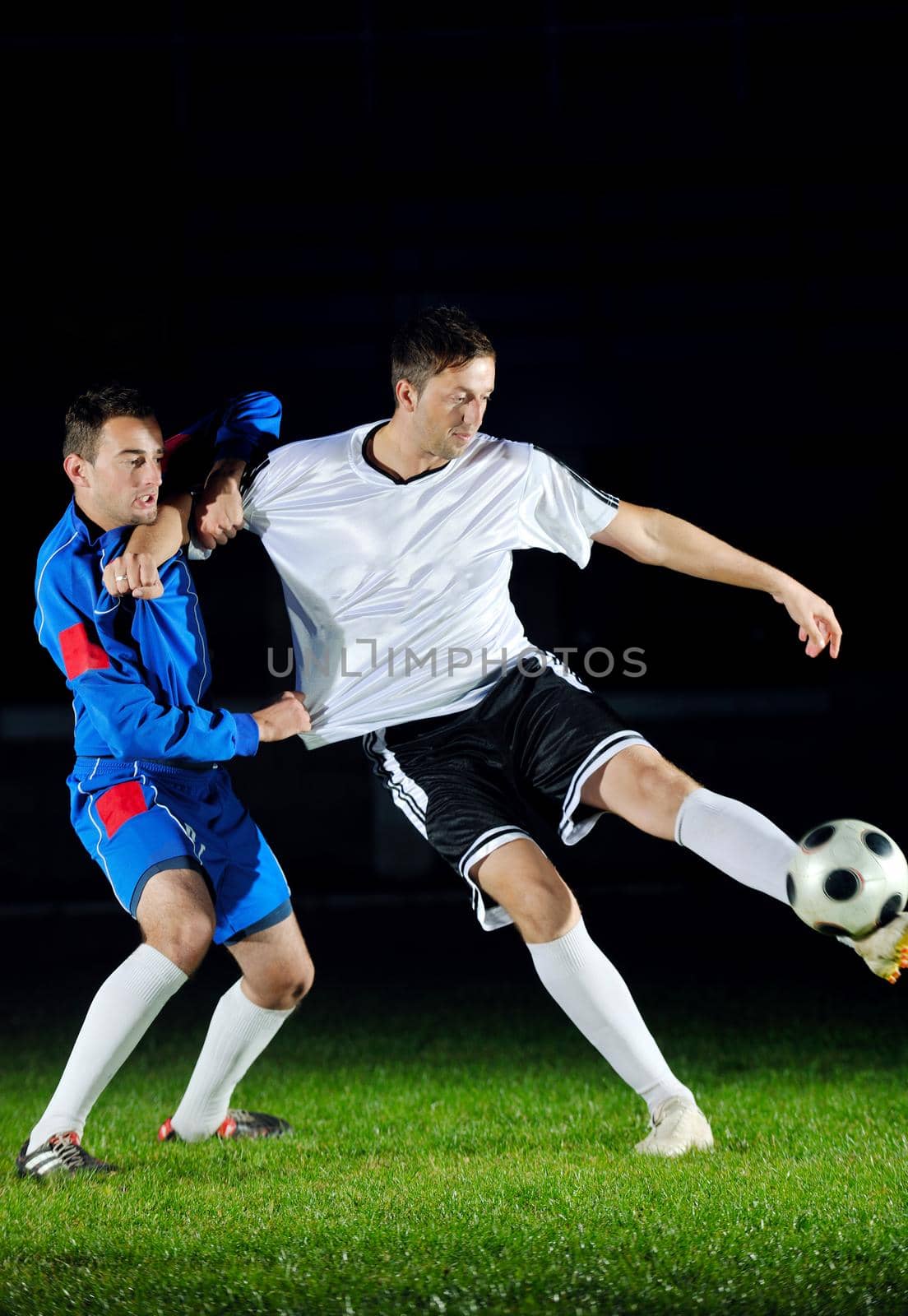 football players in action for the ball by dotshock