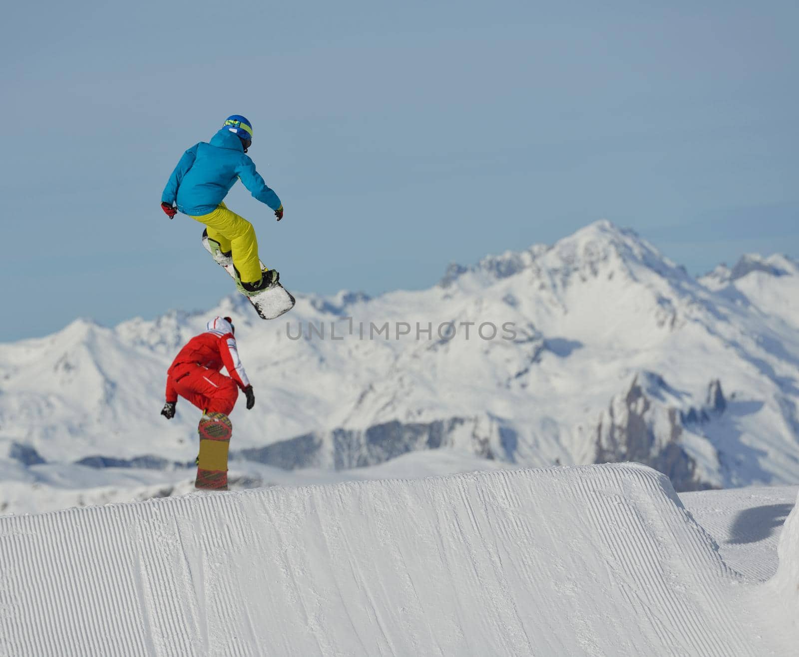 jumping skier at mountain winter snow fresh suny day