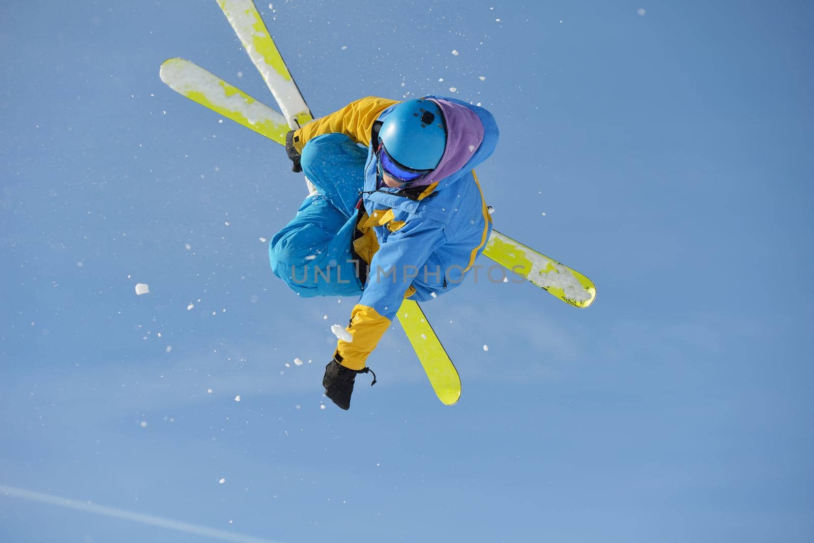 jumping skier at mountain winter snow fresh suny day