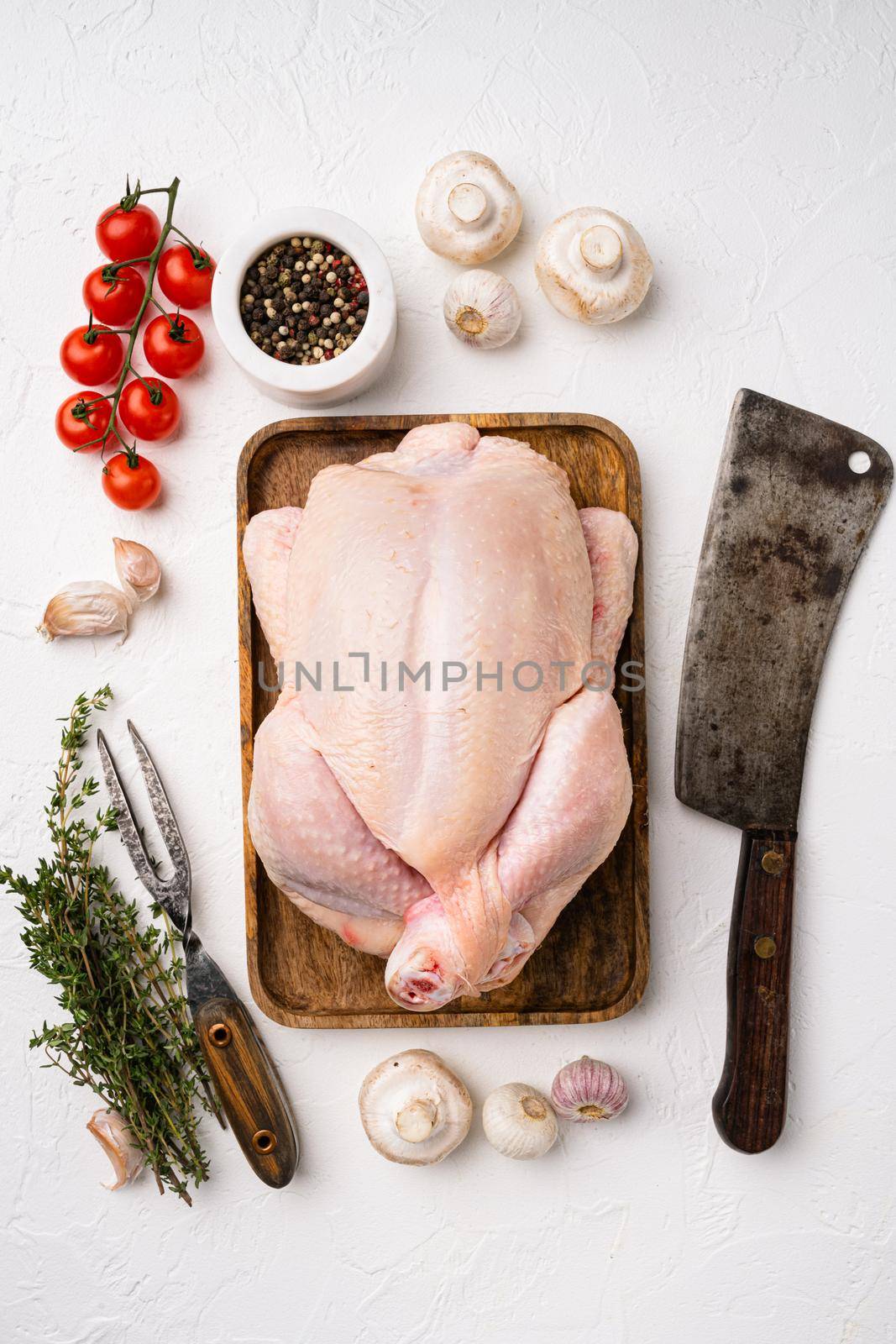 Chicken whole raw meat set, on white stone table background, top view flat lay