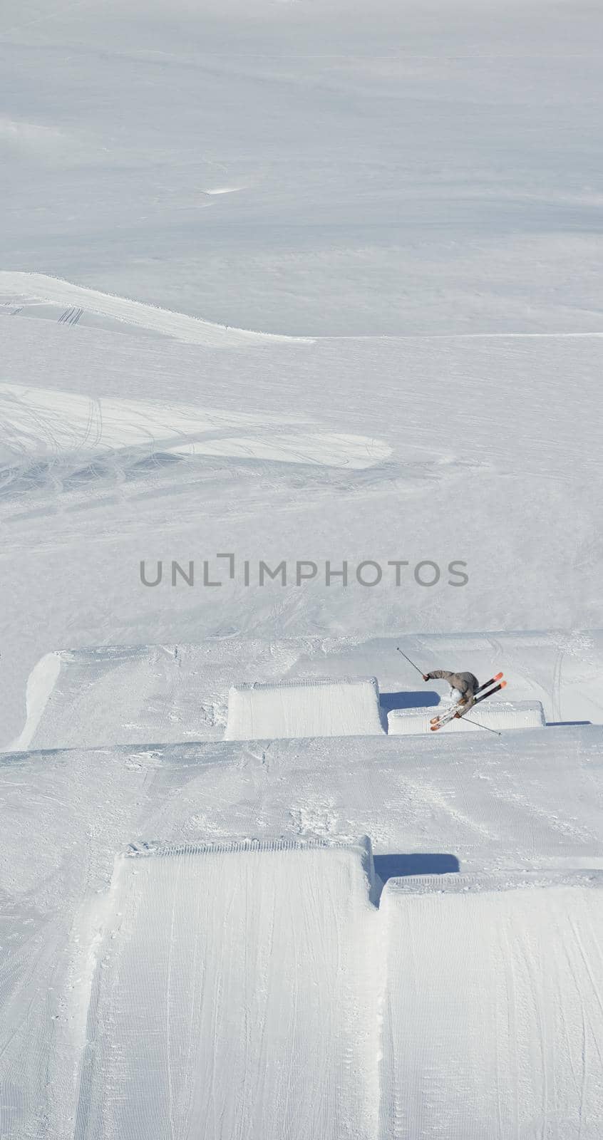 jumping skier at mountain winter snow fresh suny day