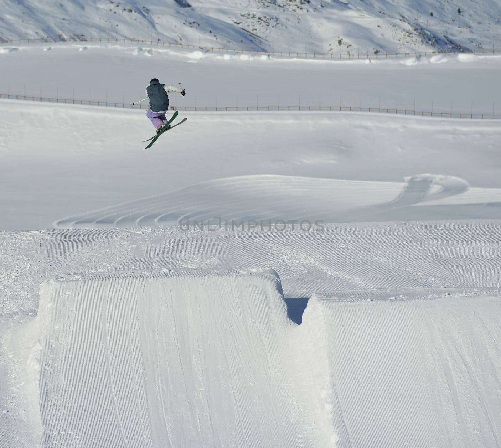 jumping skier at mountain winter snow fresh suny day