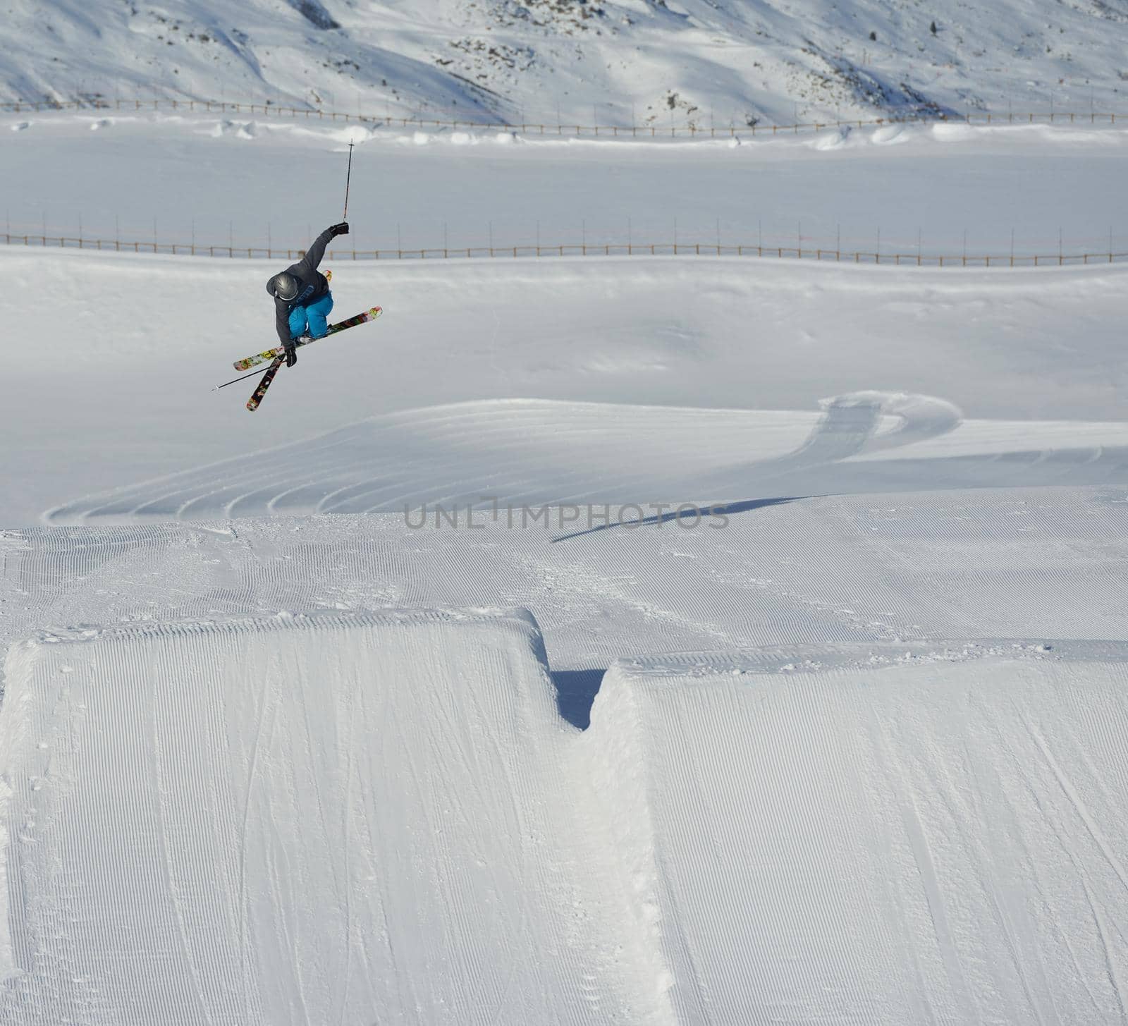 jumping skier at mountain winter snow fresh suny day