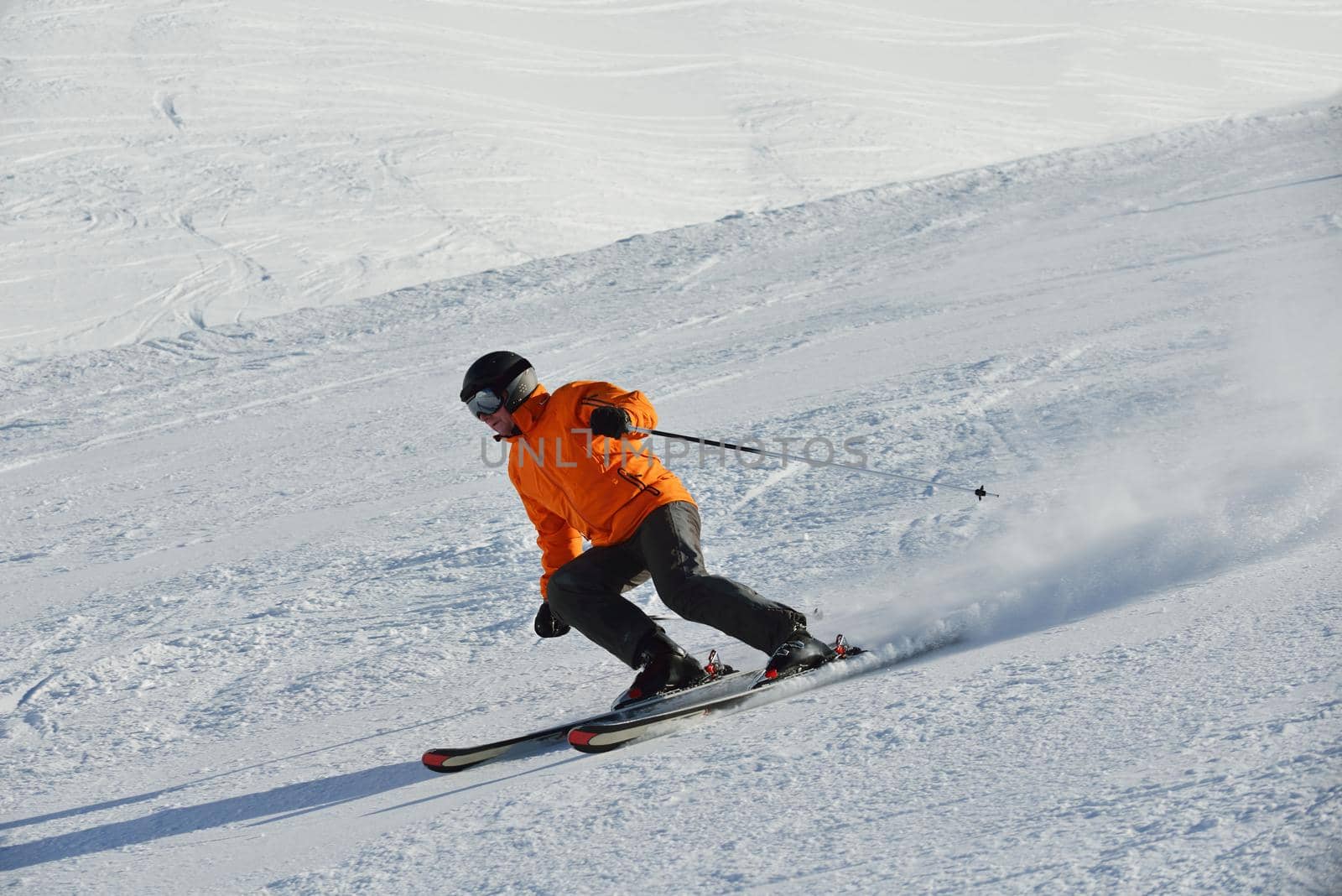 jumping skier at mountain winter snow fresh suny day