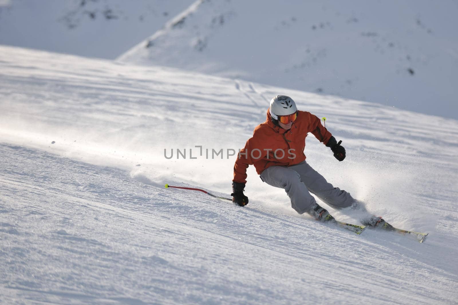 young athlete man have fun during skiing sport on hi mountain slopes at winter seasson and sunny day