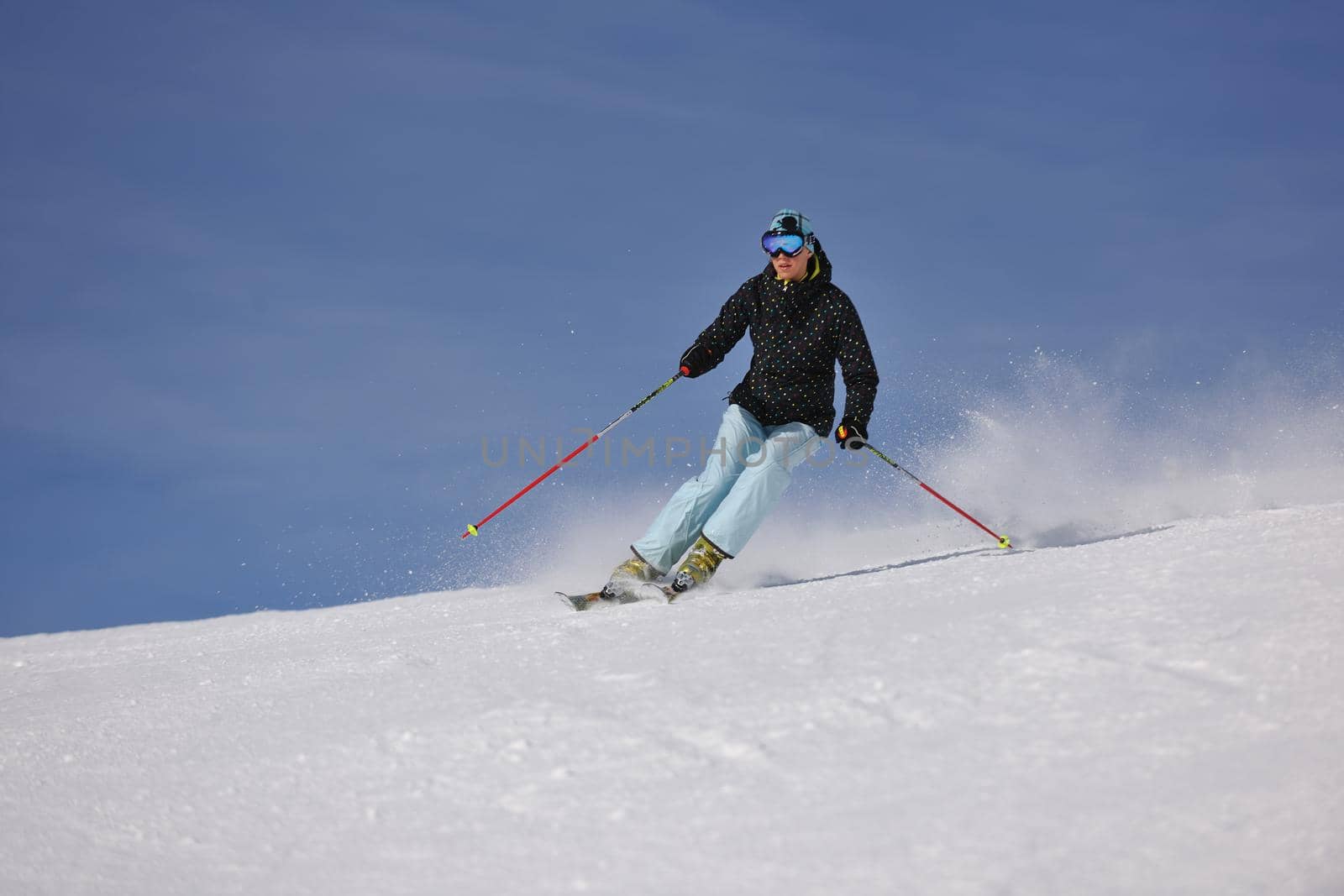 young athlete man have fun during skiing sport on hi mountain slopes at winter seasson and sunny day