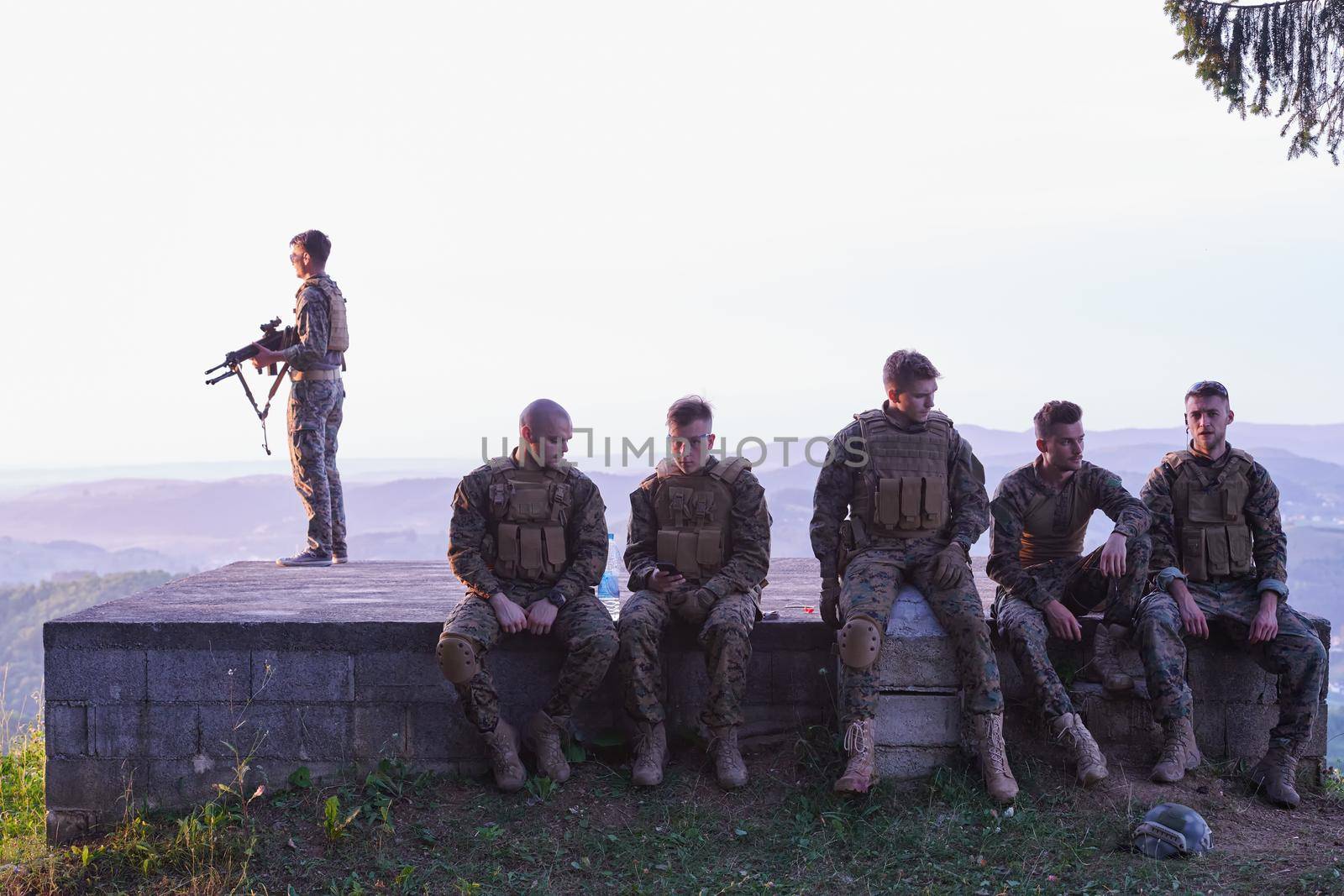 soldiers squad relaxing after battle having a break on training