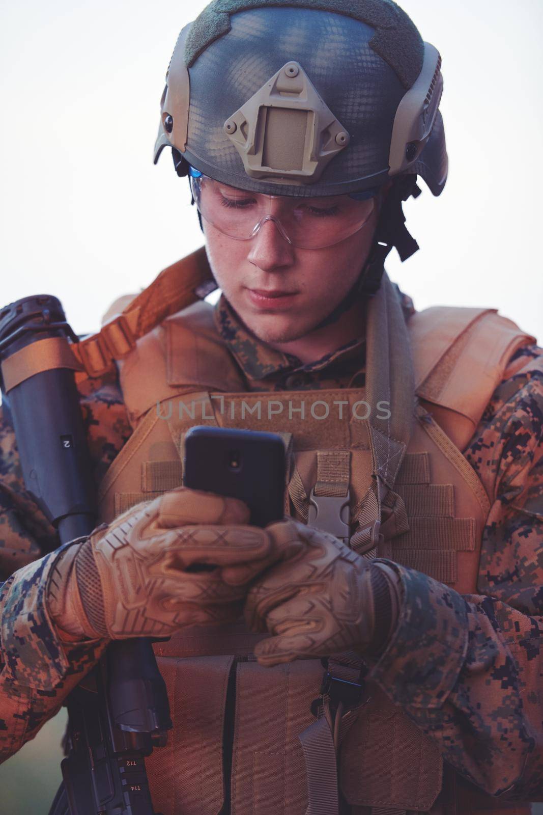 soldier using smart phone by dotshock