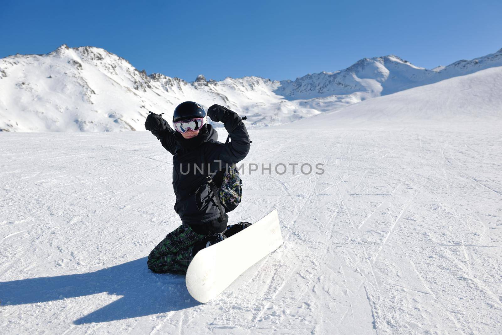 skiing on fresh snow at winter season at beautiful sunny day by dotshock