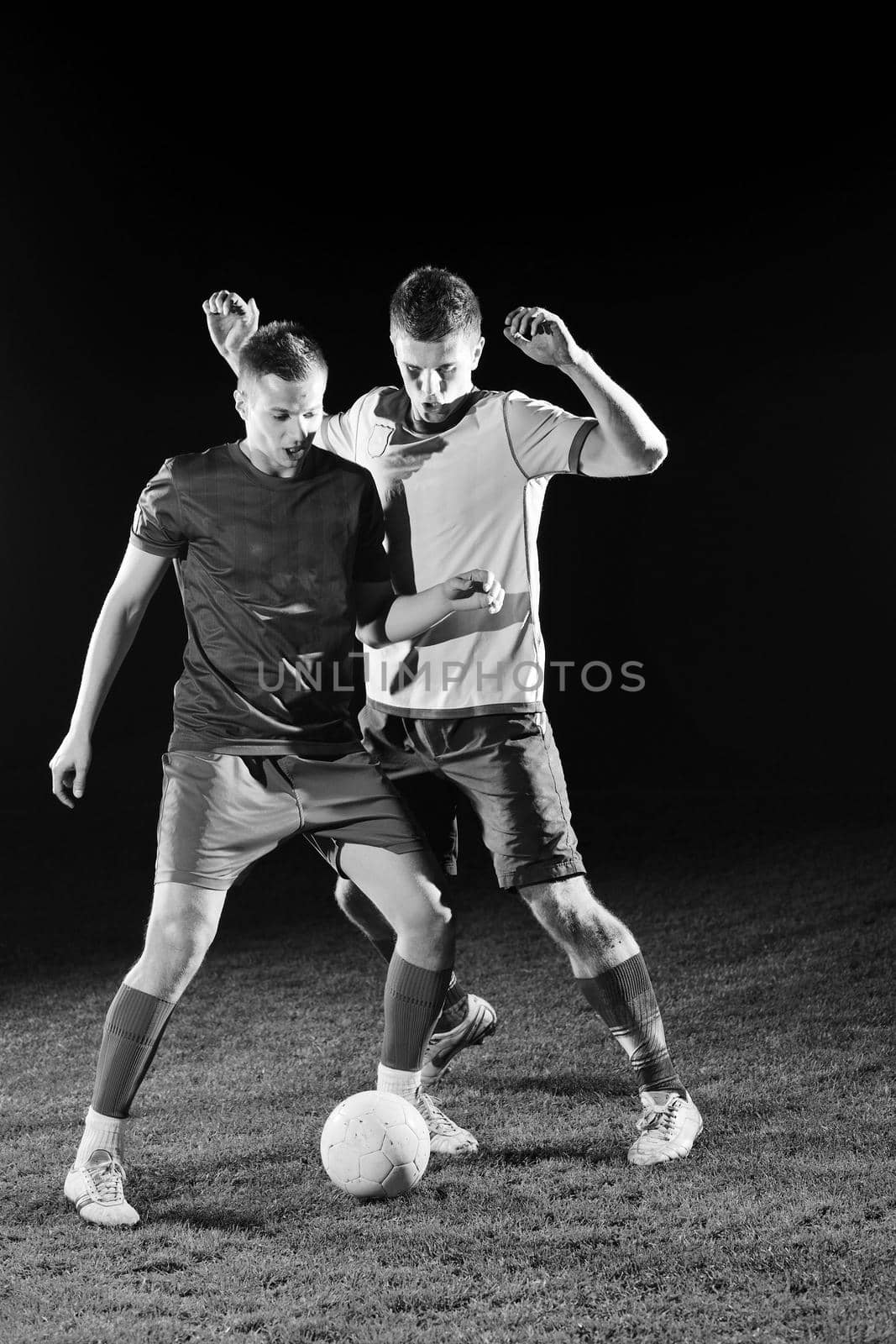 football players in competition for the ball by dotshock