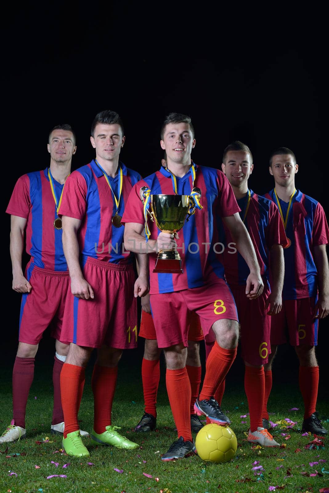 soccer players team group celebrating the victory and become champion of game while holding win coup