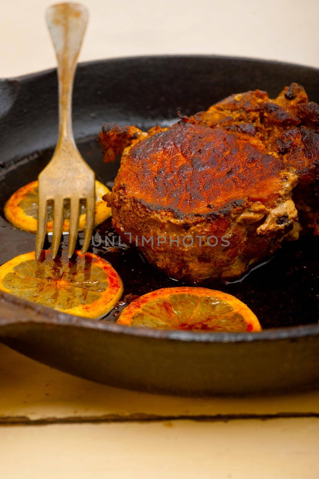pork chop seared on iron skillet by keko64