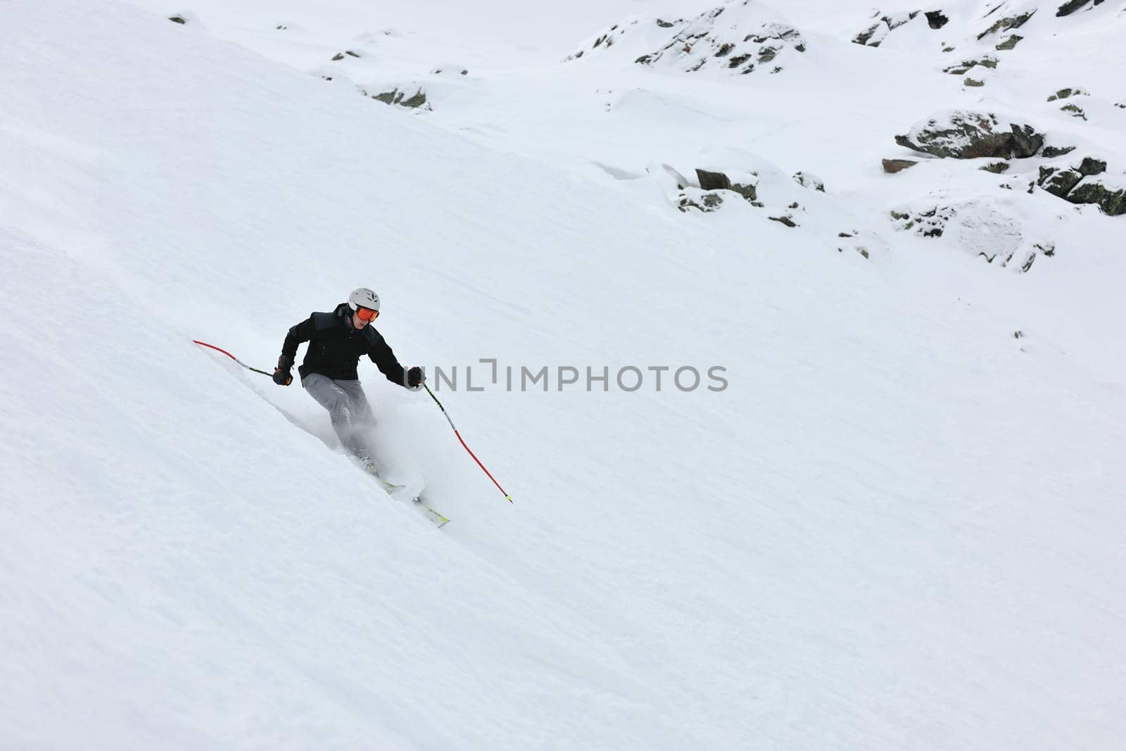 young athlete man have fun during skiing sport on hi mountain slopes at winter seasson and sunny day