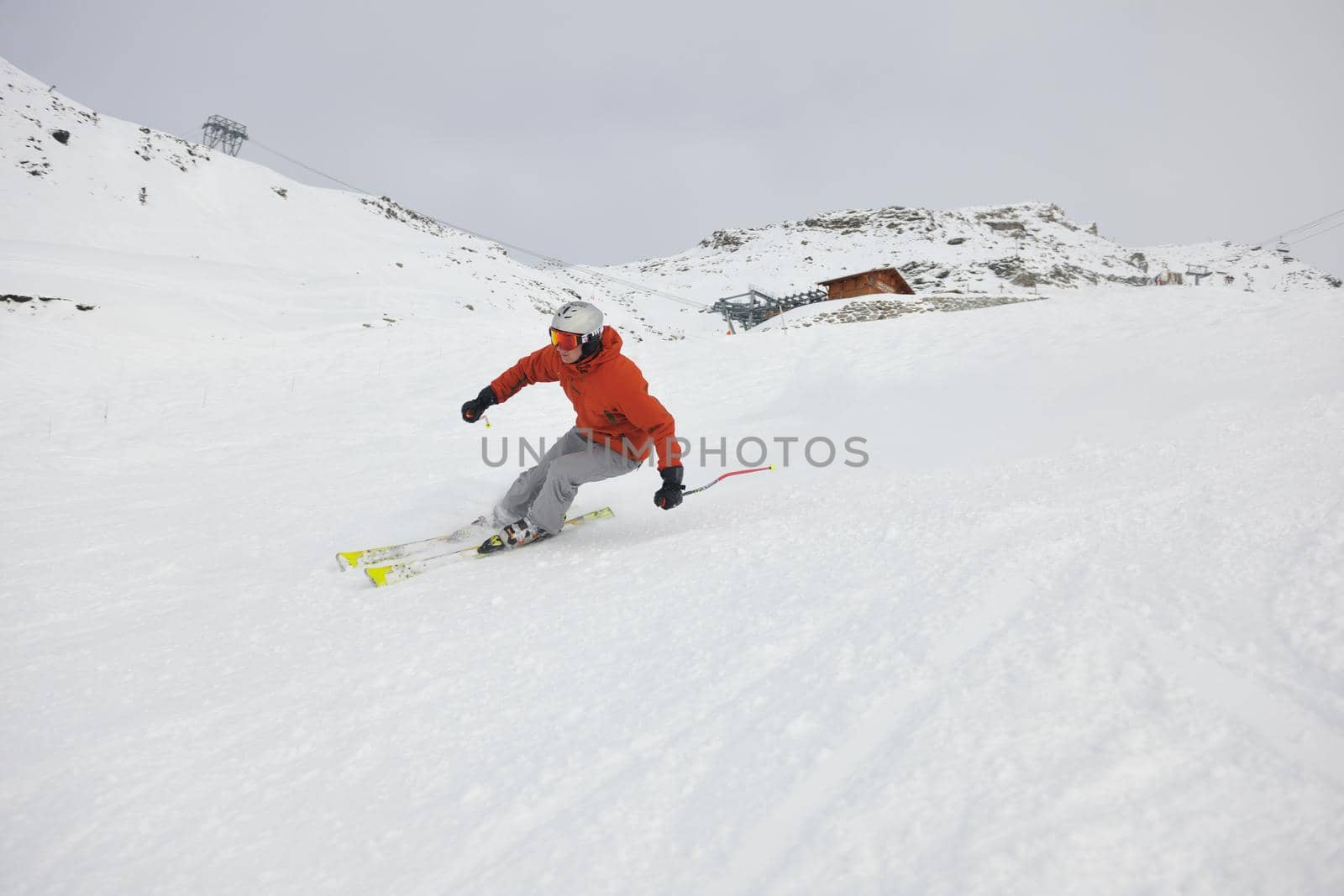 young athlete man have fun during skiing sport on hi mountain slopes at winter seasson and sunny day