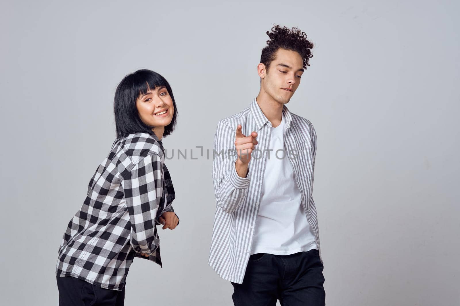 young couple modern clothes posing fun friendship by Vichizh
