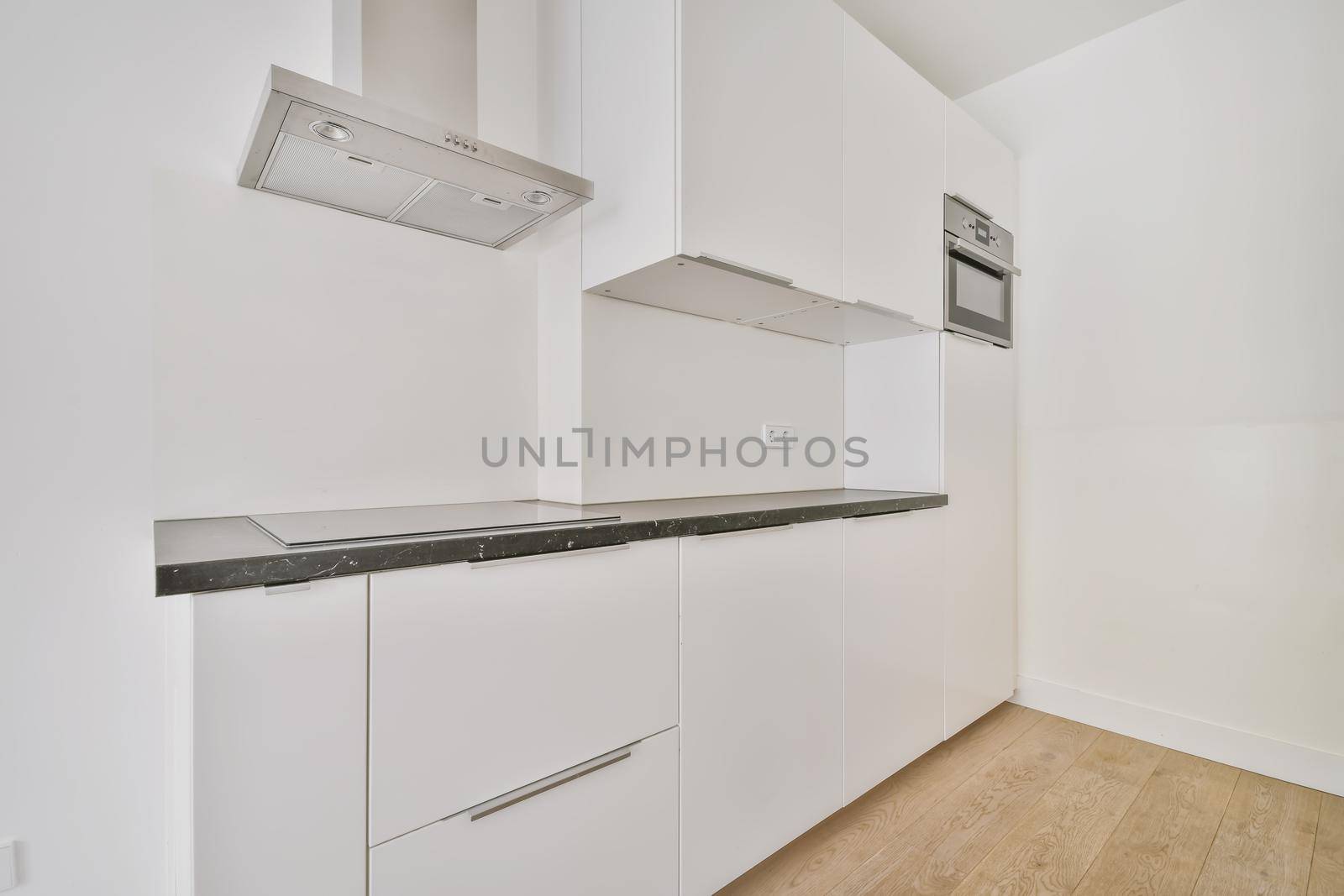 The interior of the kitchen area with a snow-white kitchen set