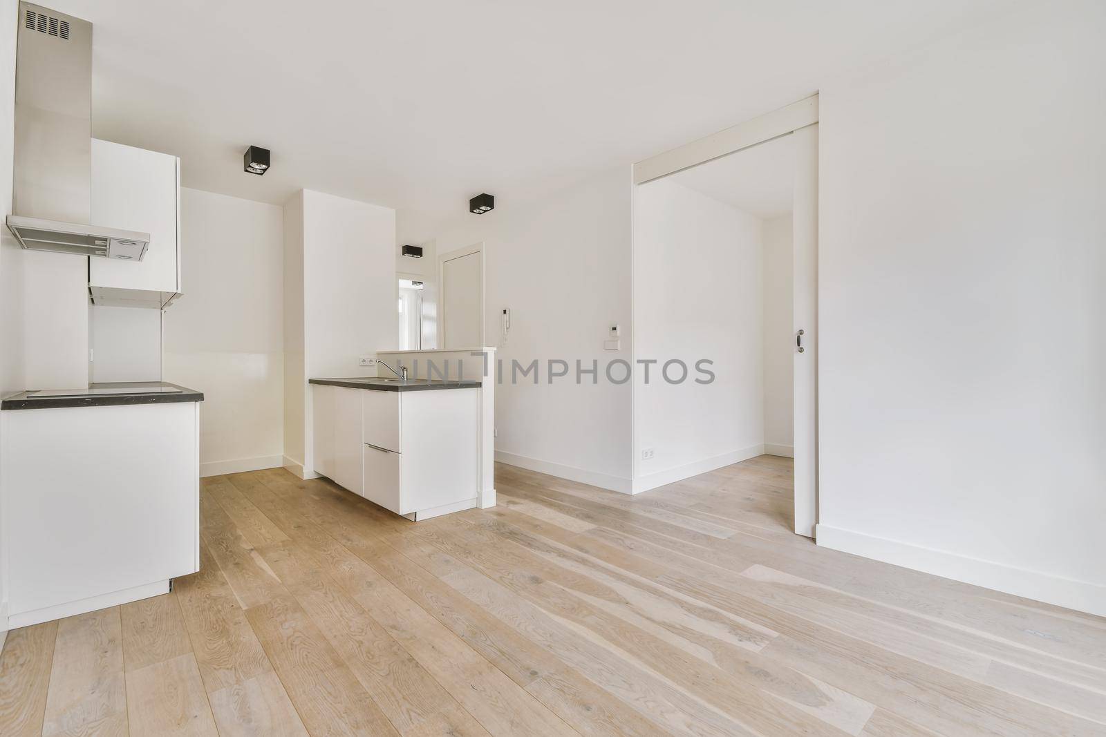 Empty room interior in daylight with parquet floor