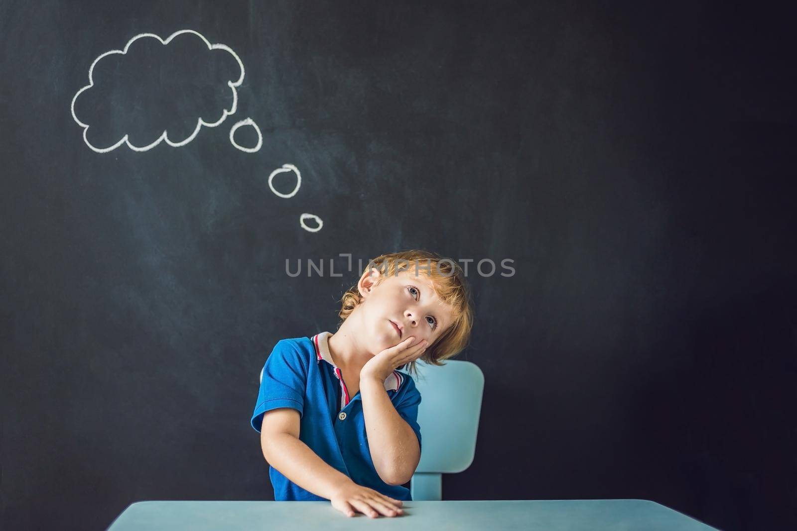 Closeup portrait of Cute little boy thinking deeply about something Copy space.