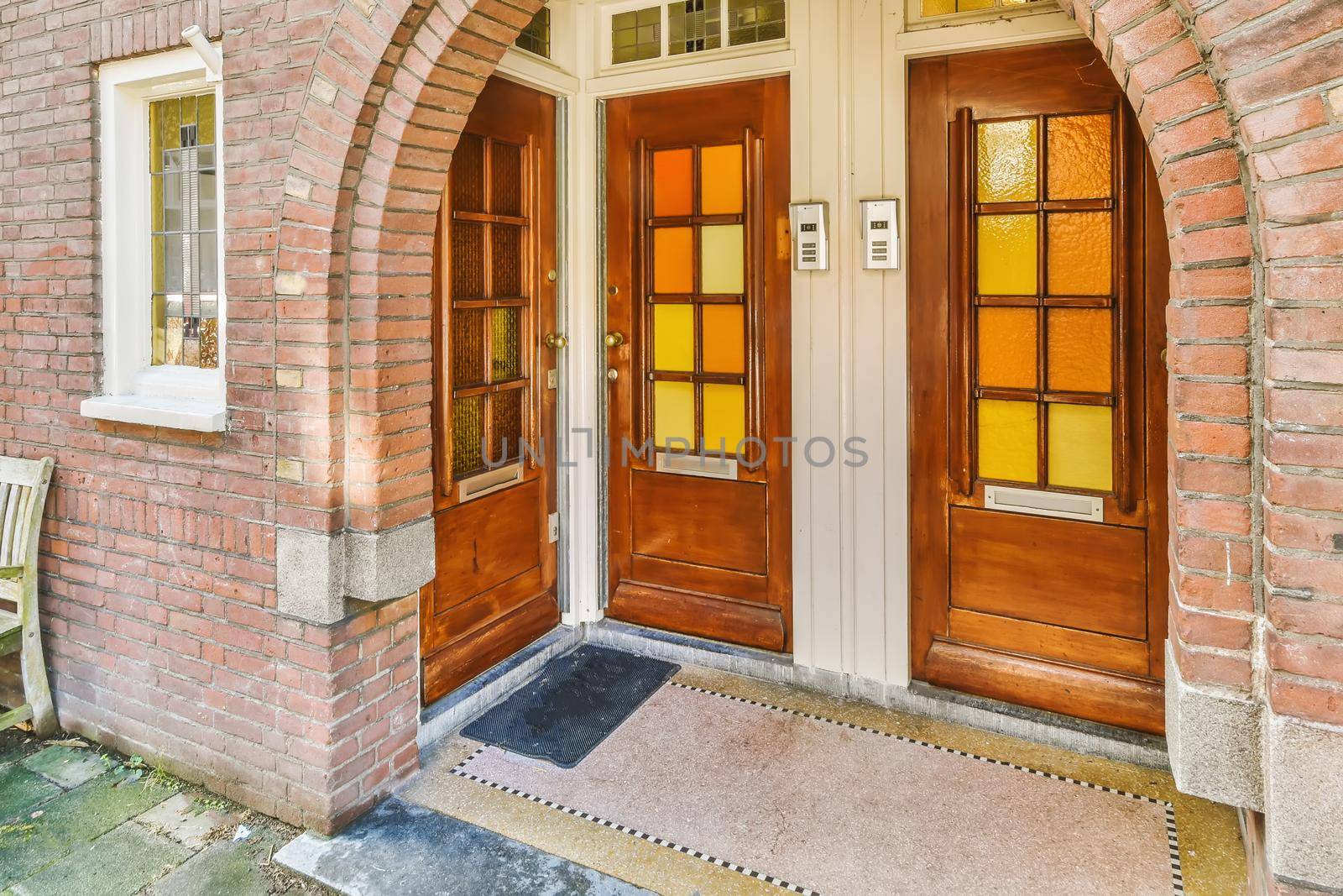 Wooden entrance doors with yellow glasses by casamedia