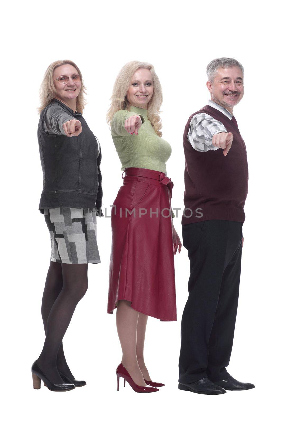 in full growth. group of happy fashion people pointing at you. isolated on a white background