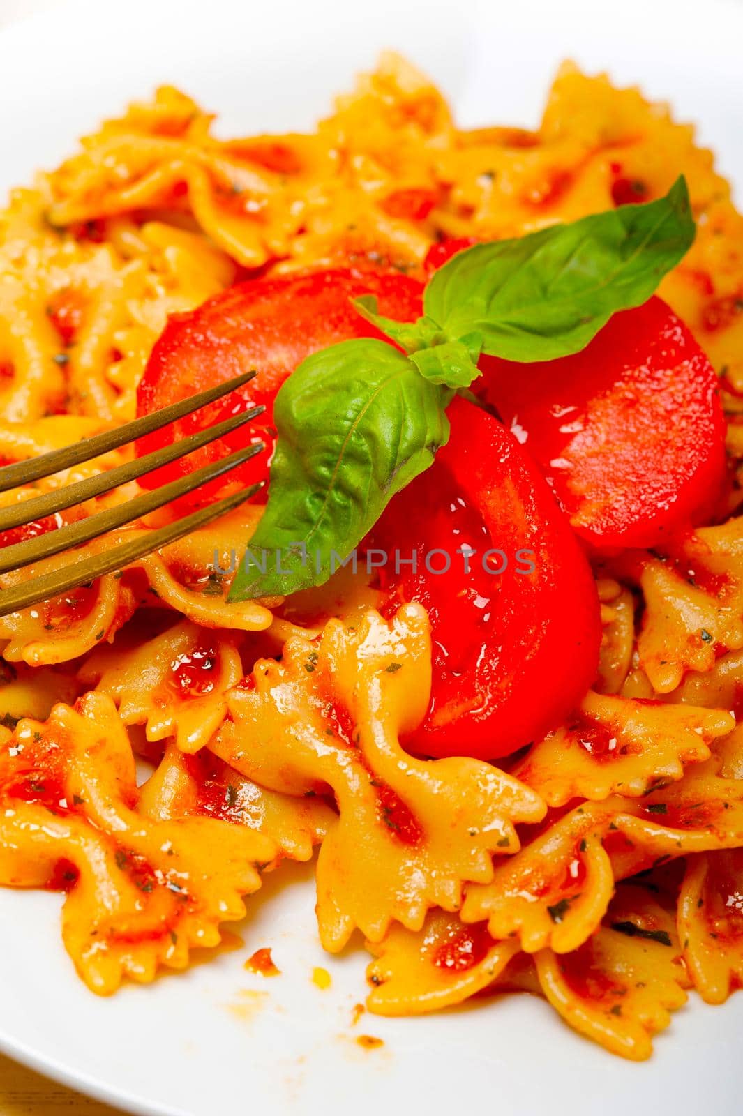 Italian pasta farfalle butterfly bow-tie and tomato sauce by keko64