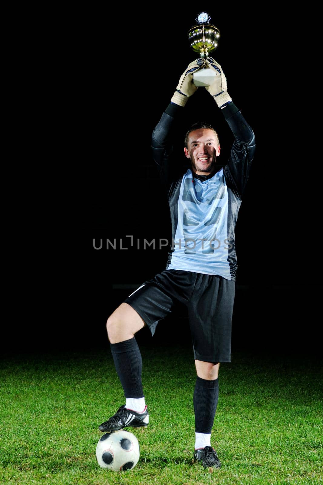 goalkeeper  soccer player people  on football stadium grass field