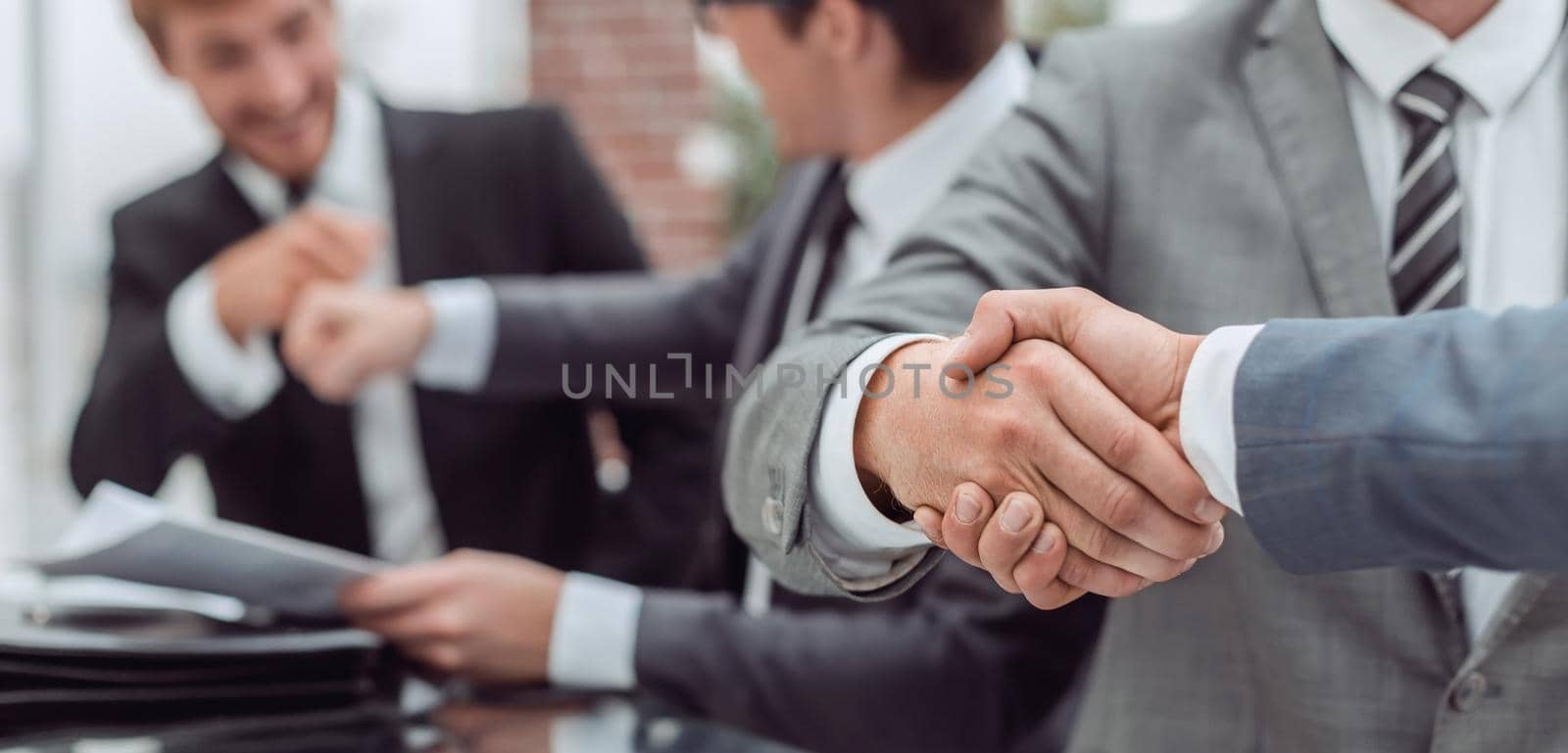 close up. business people shaking hands during a business meeting . business concept
