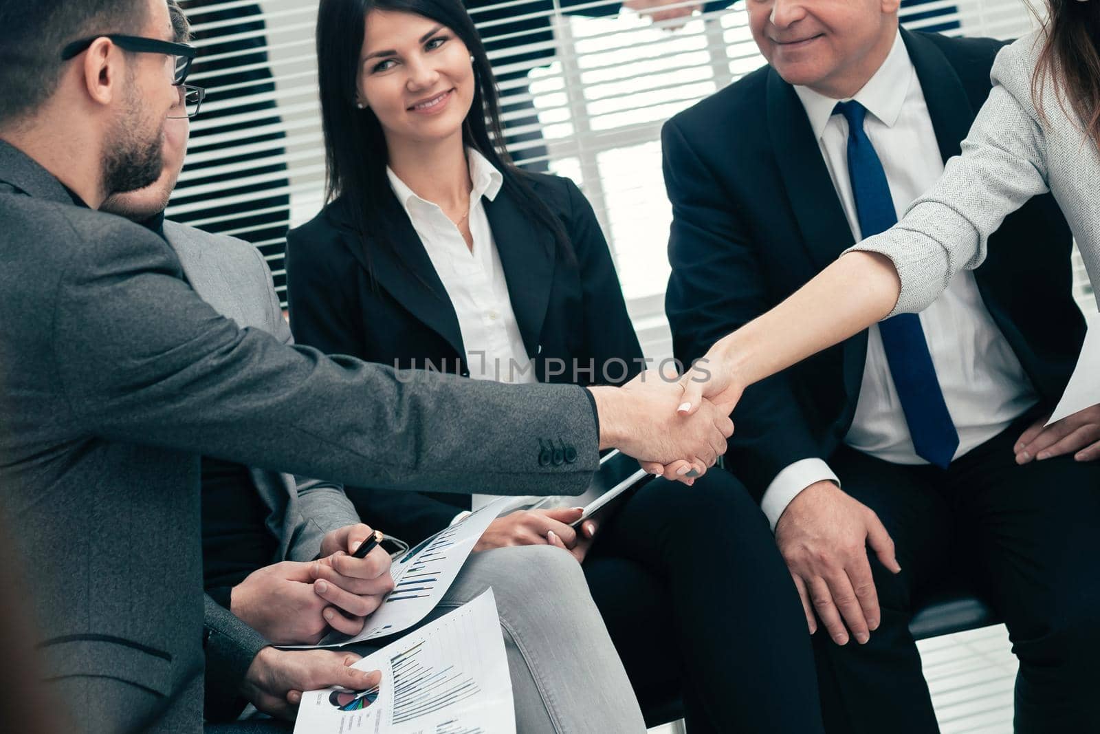 business colleagues shaking hands with each other. the concept of teamwork