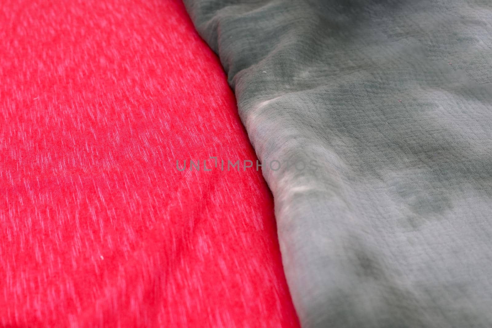 Detailed close up view on samples of cloth and fabrics in different colors found at a fabrics market by MP_foto71