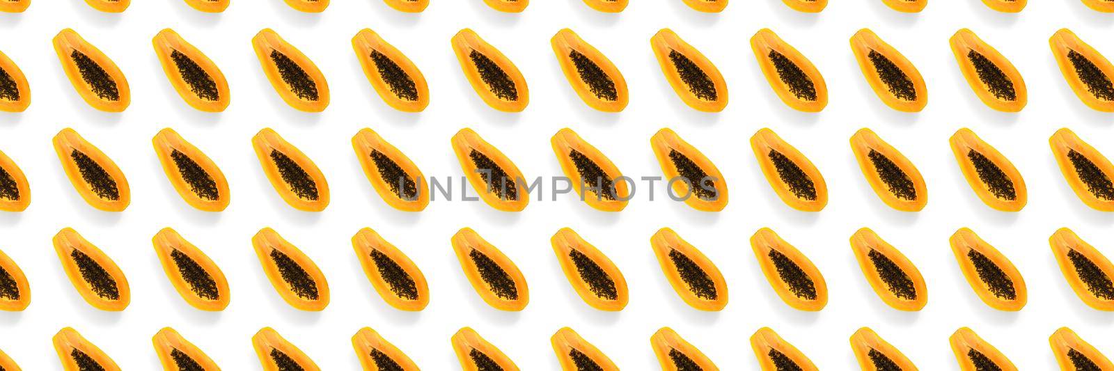 Fresh ripe papaya background on white backdrop. Modern tropical abstract background. Top view. Creative design, minimal flat lay concept. Trend tropical fruit food background - not seamless pattern