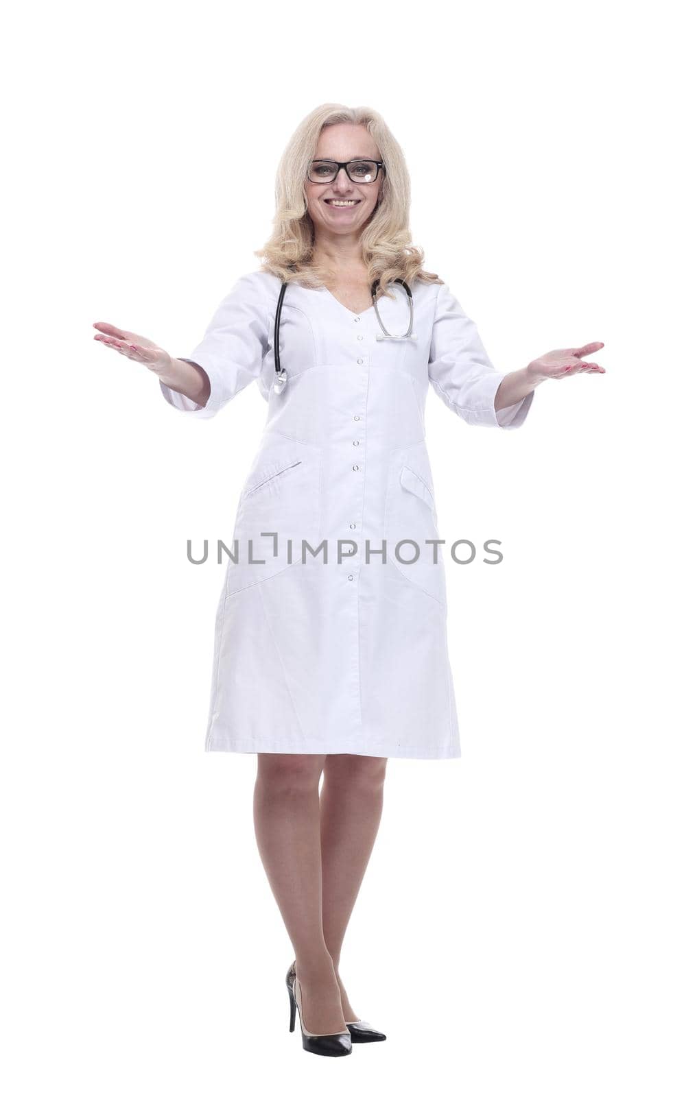 in full growth. attractive female doctor smiles and gives a thumbs up . isolated on a white