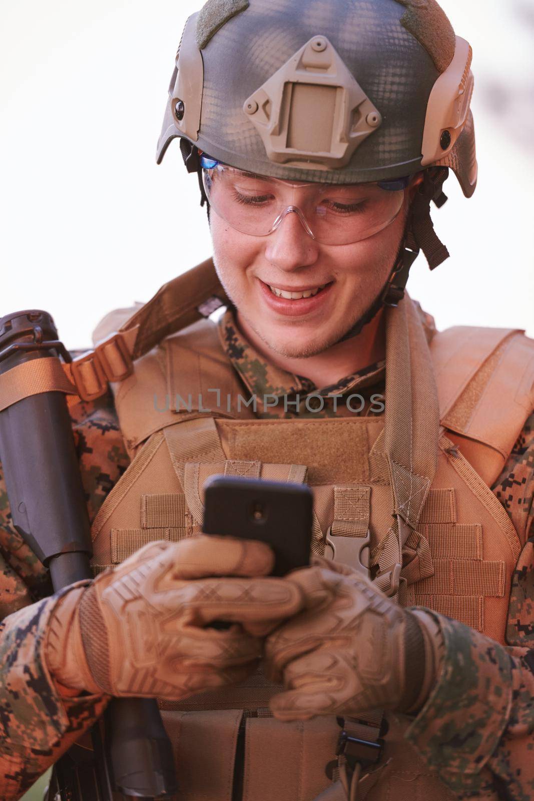 soldier using smart phone by dotshock