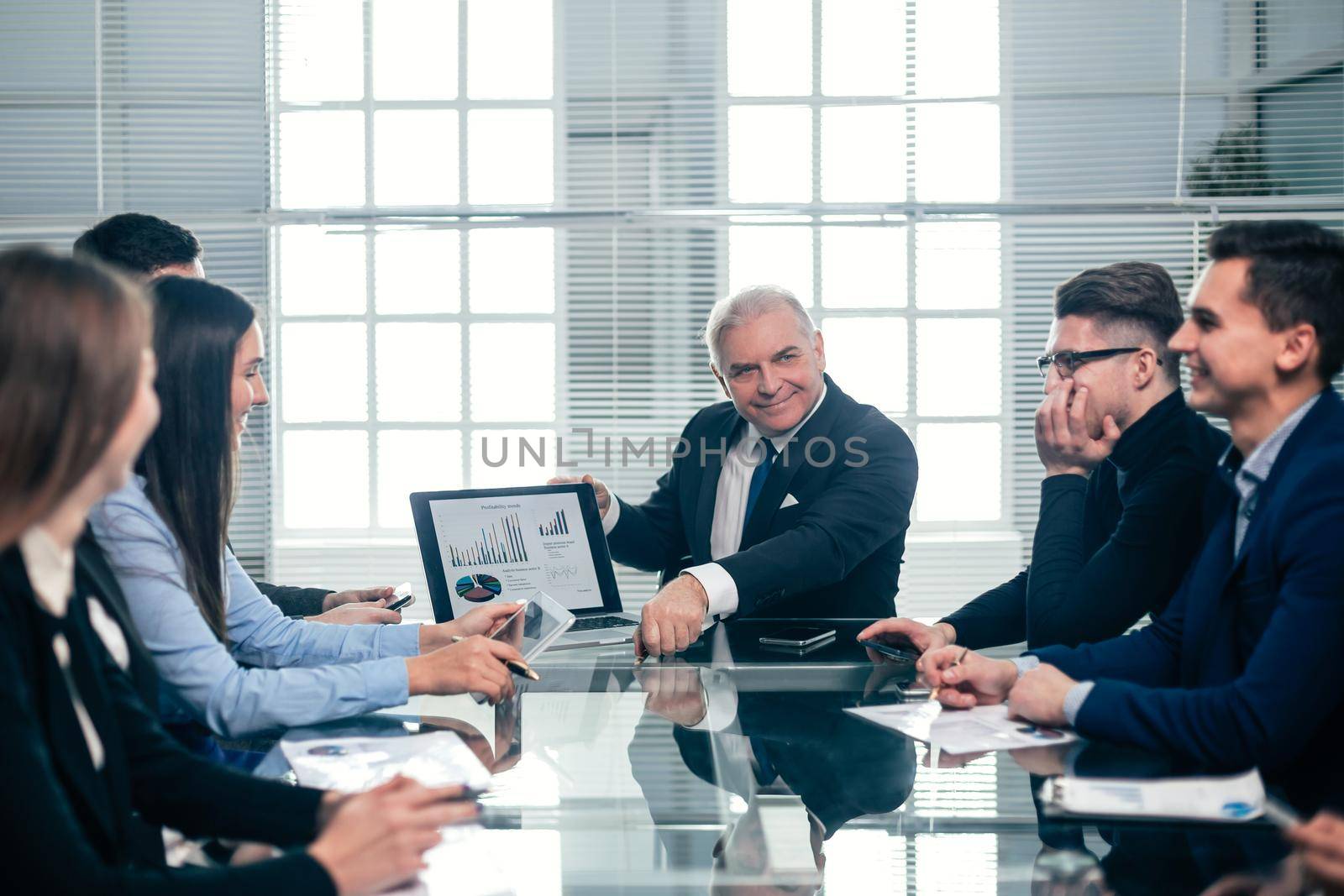 businessman discussing financial data at a working meeting by SmartPhotoLab