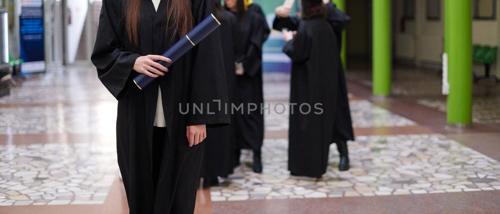 Happy woman portrait on her graduation day University. Education and people.