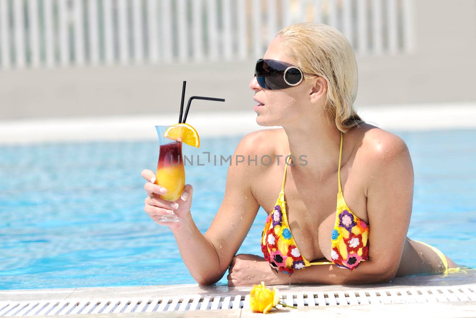 beautiful young woman relax and have fun at swimming pool