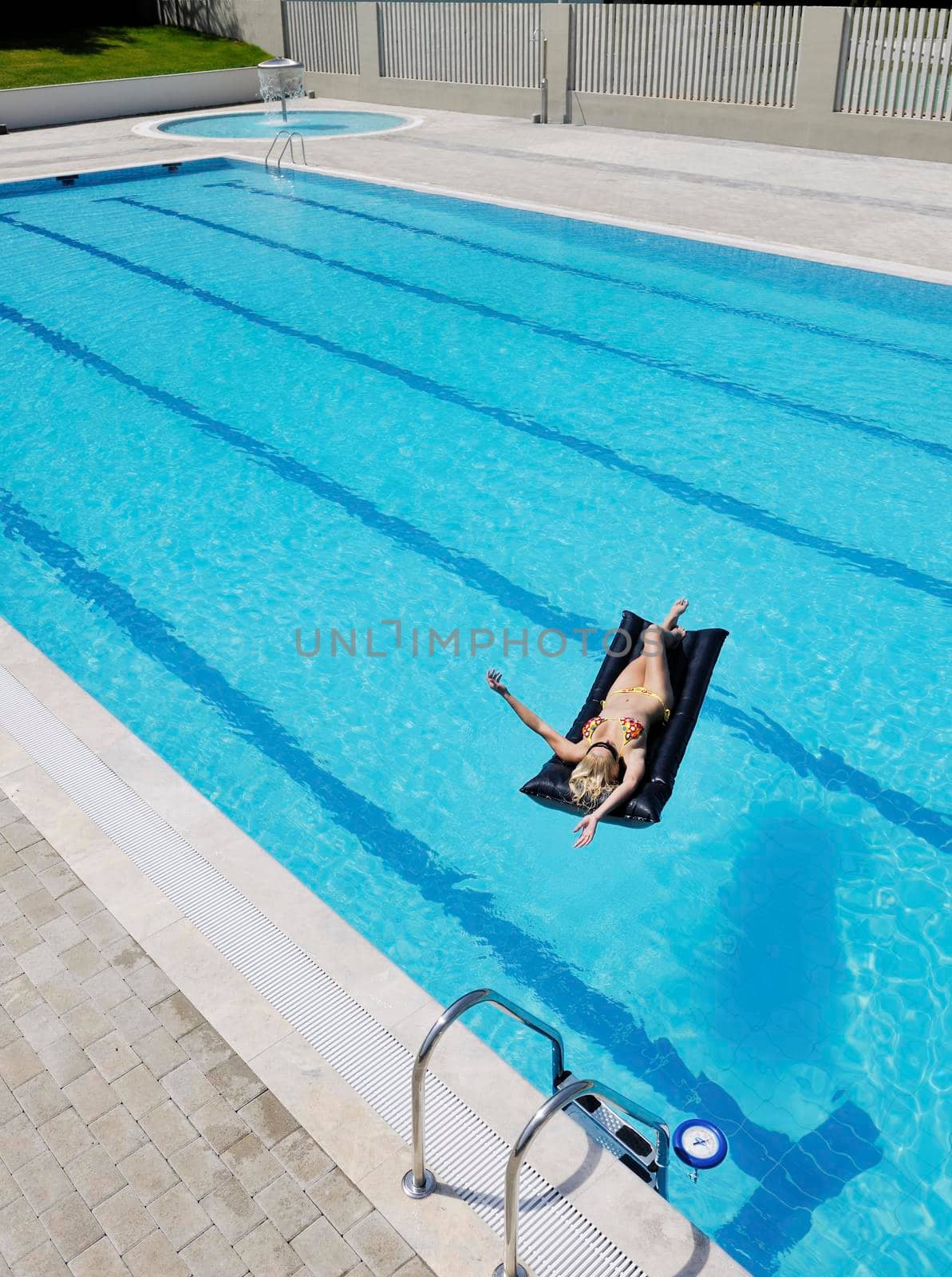 beautiful young woman relax and have fun at swimming pool