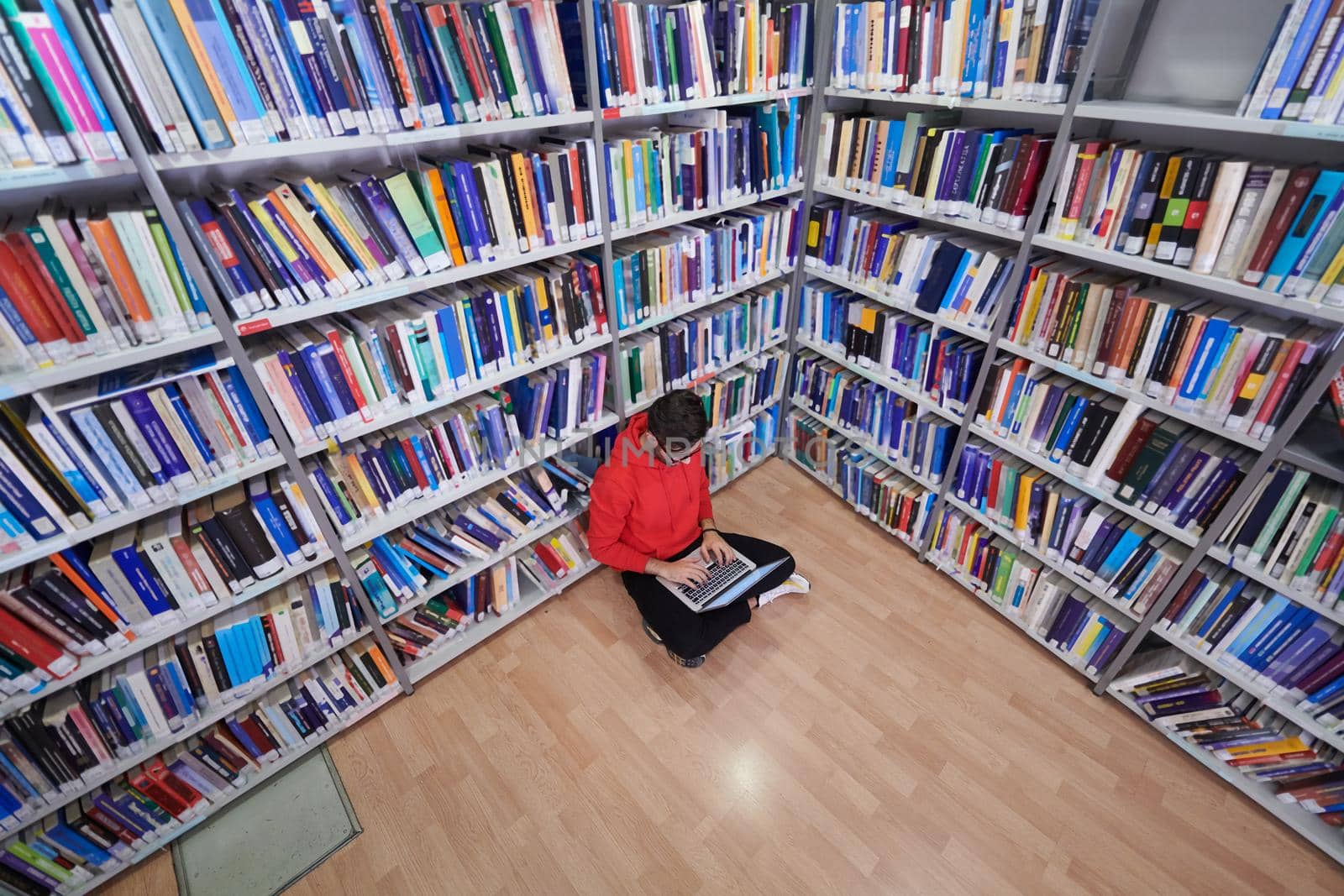 the students uses a notebook, laptop and a school library by dotshock