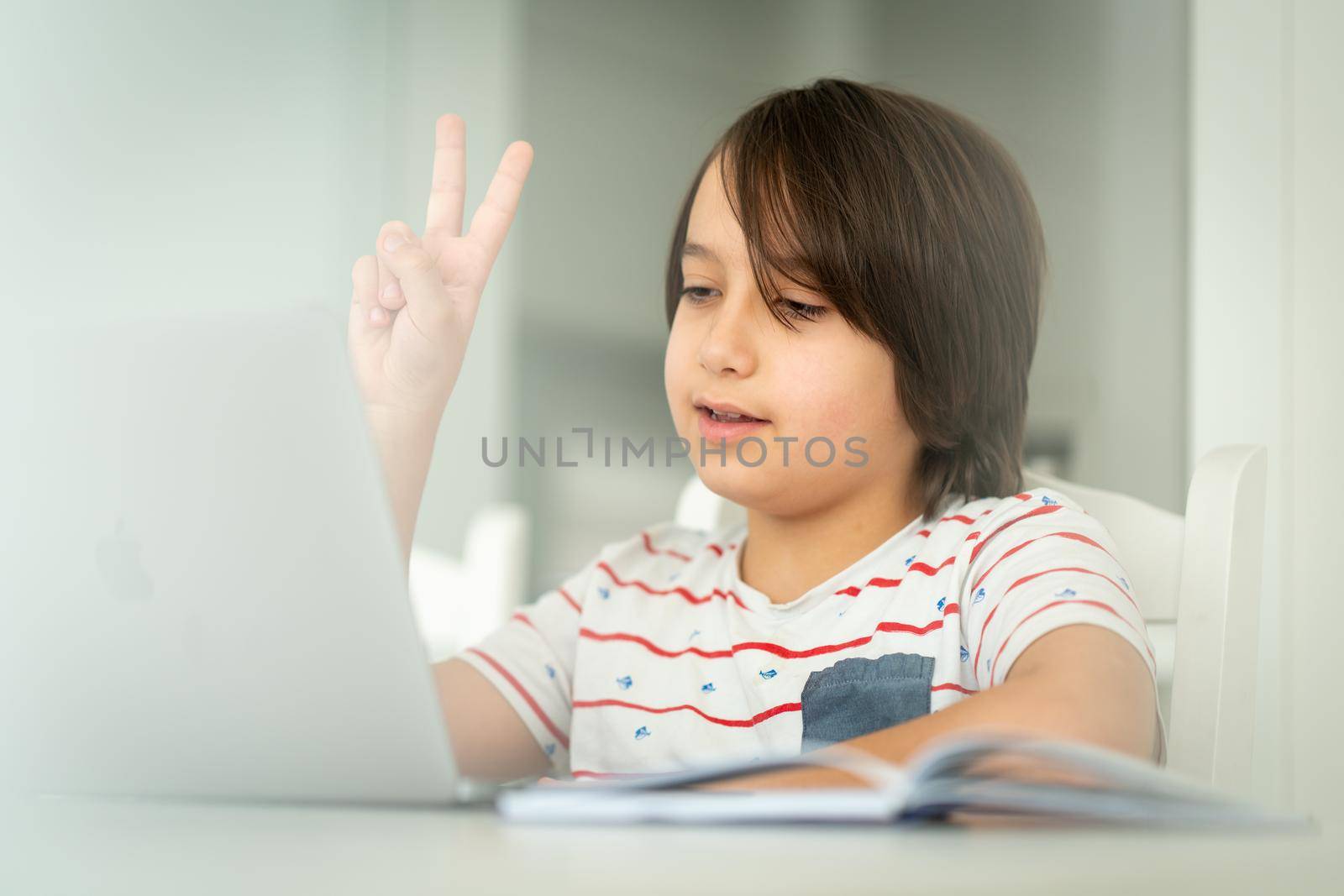 Child using laptop at home indoors. high quality photo