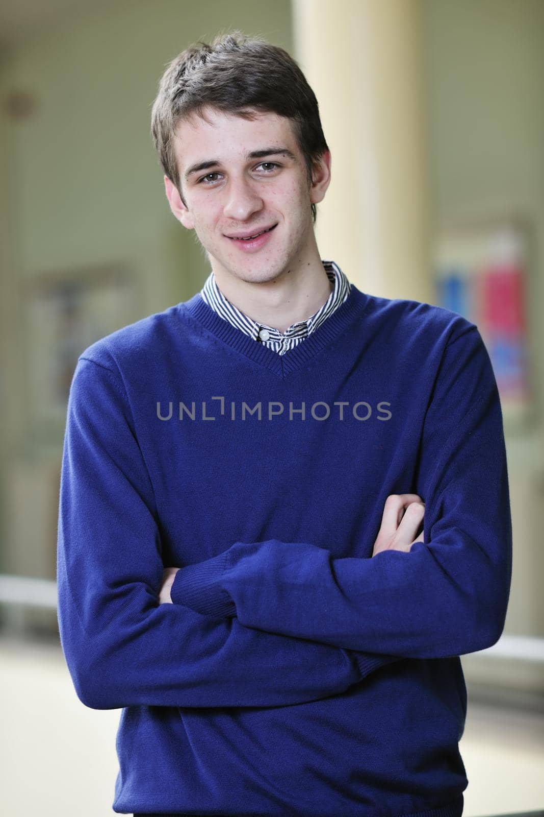 happy young student boy possing at university campus and reopresenting education concept