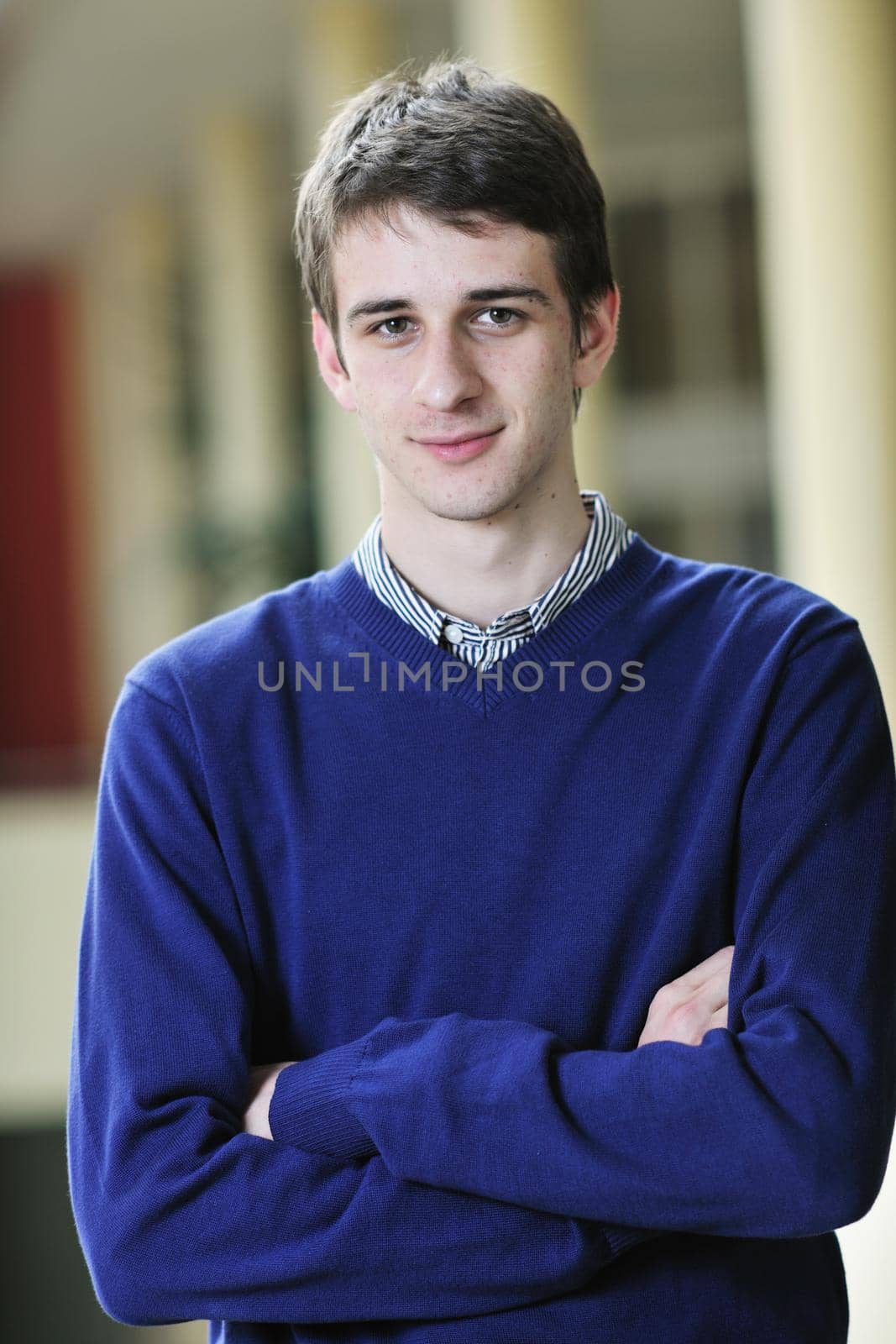 happy young student boy possing at university campus and reopresenting education concept