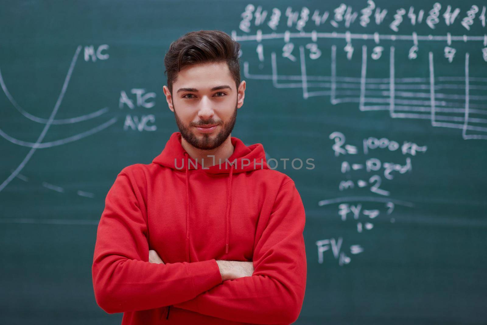 a portrait of a determined student in front of a school board