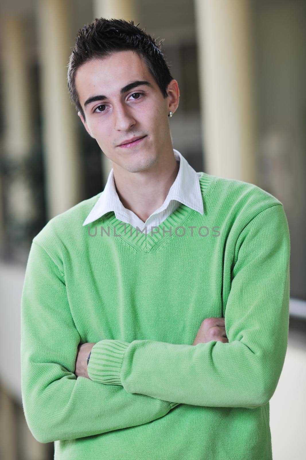 happy young student boy possing at university campus and reopresenting education concept