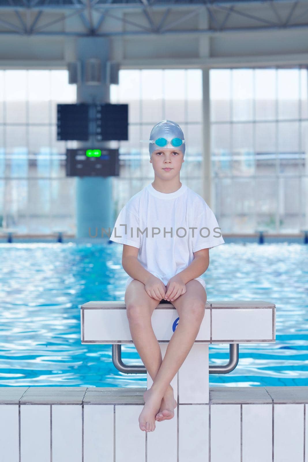 health and fitness lifestyle concept with young athlete swimmer recreating  on indoor olimpic pool