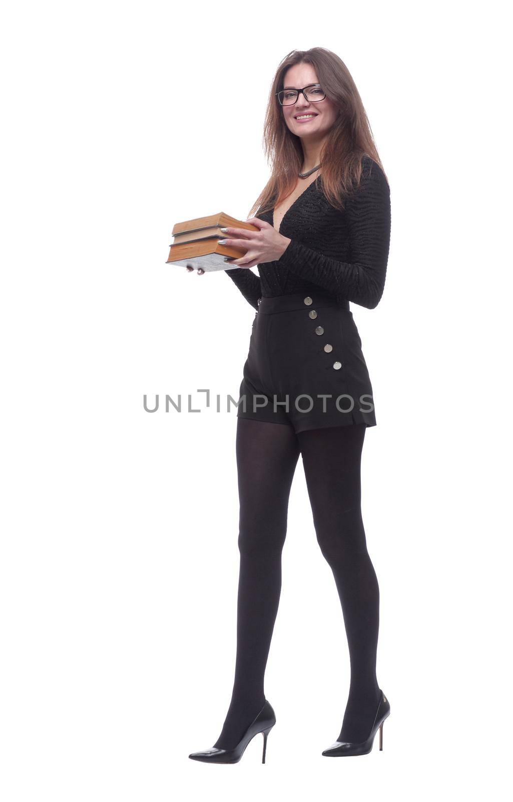 in full growth. elegant young woman with a stack of books . isolated on a white background.