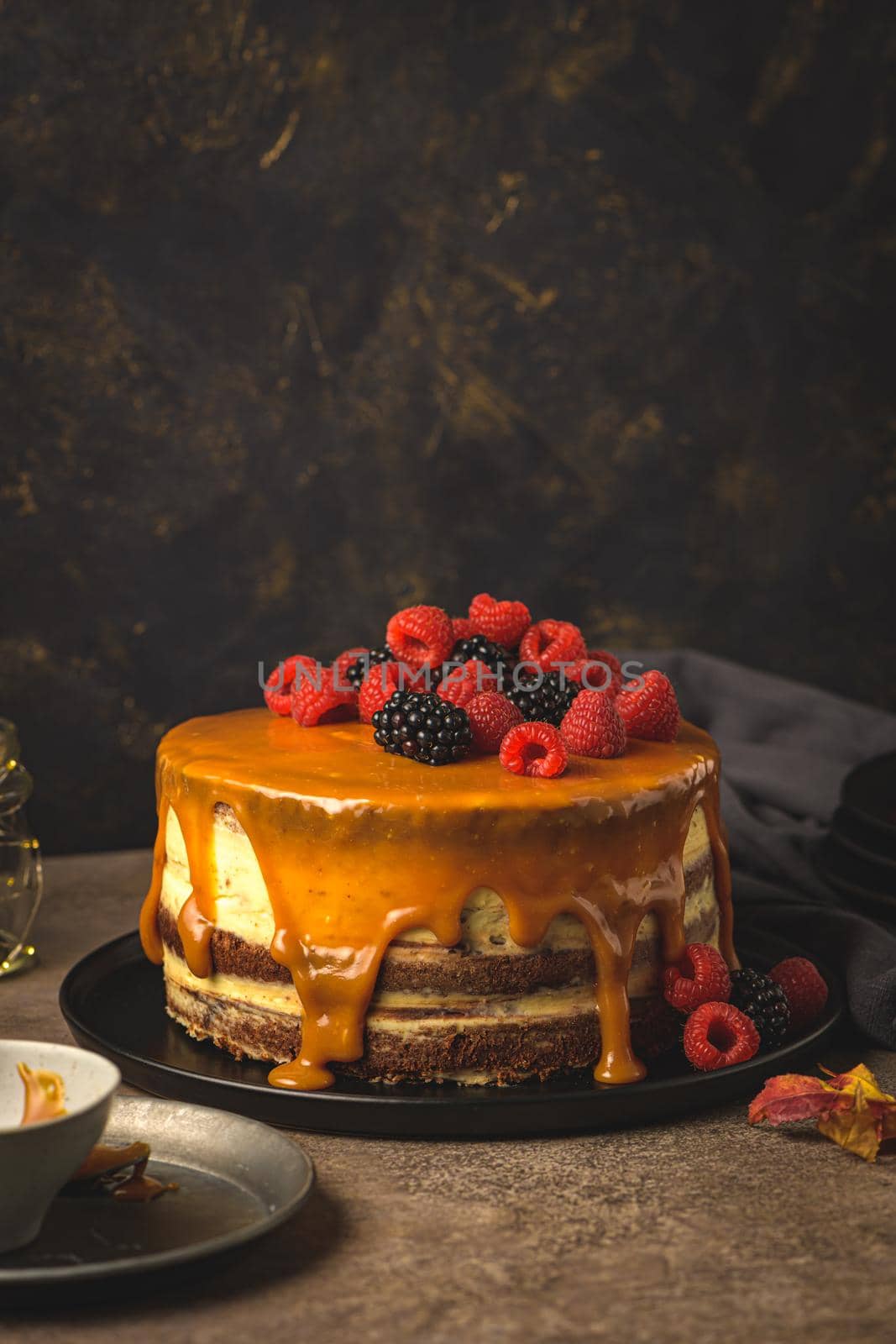 Delicious caramel cake with blackberries and raspberries.