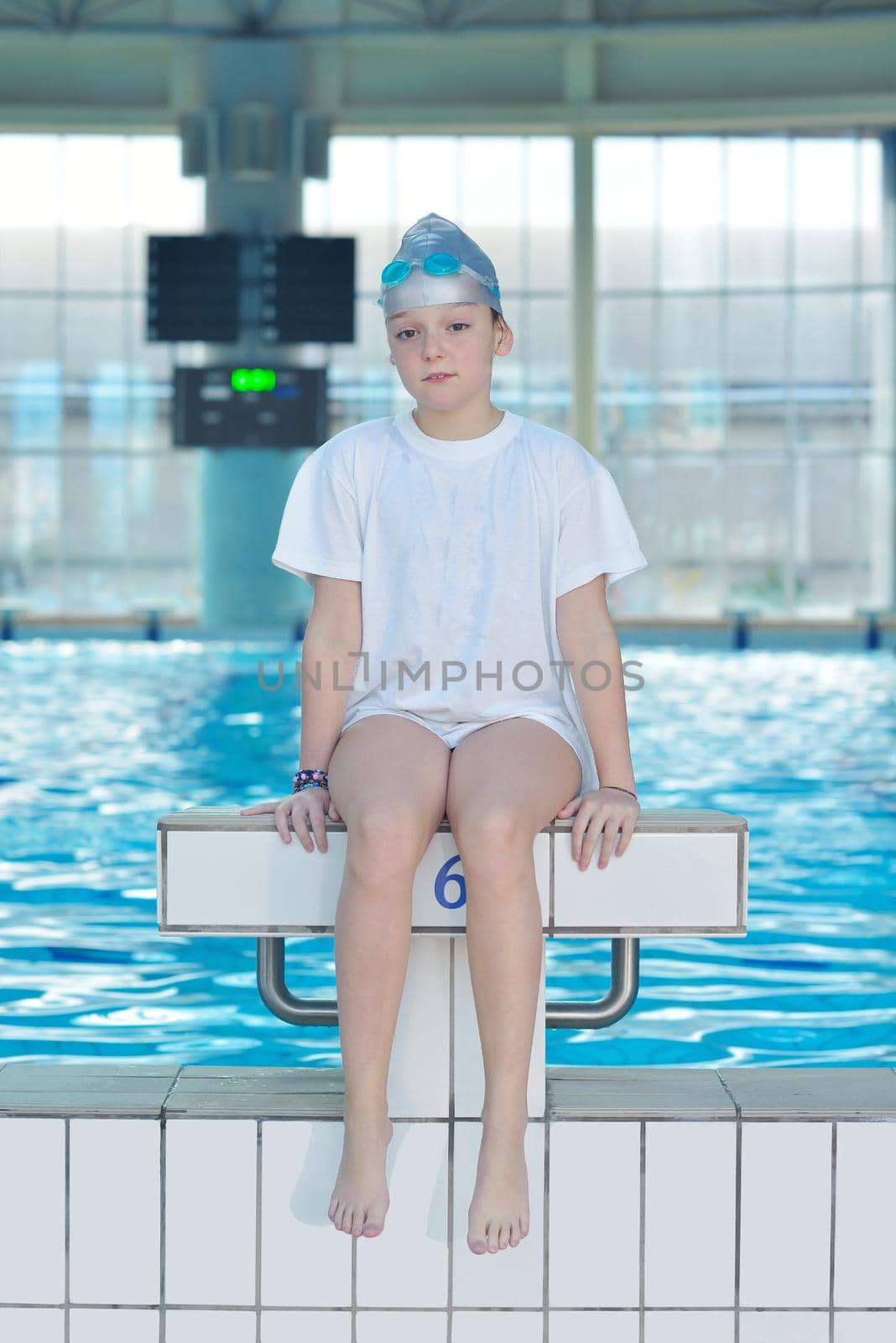 health and fitness lifestyle concept with young athlete swimmer recreating  on indoor olimpic pool